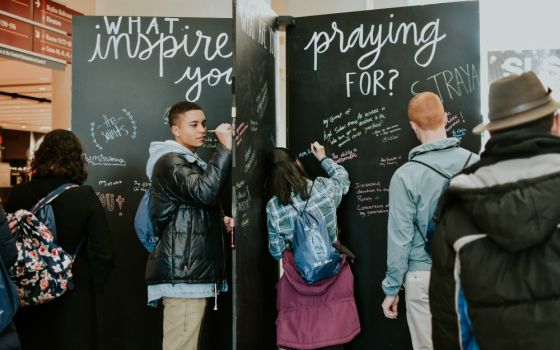 Attendees add prayer intentions and inspirational phrases to a display at the Student Leadership Summit, sponsored by the Fellowship of Catholic University Students in Chicago Jan. 2-6. (Courtesy of FOCUS)