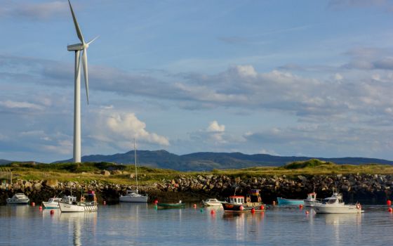 A wind turbine stands over in Burtonport, County Donegal, Ireland, in 2014. (Wikimedia Commons/Jakub Michankow)