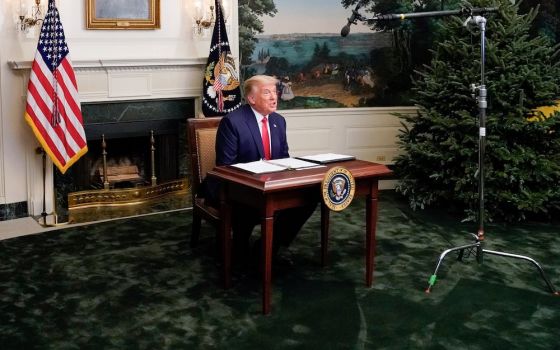 President Donald Trump participates in a Thanksgiving video teleconference with members of the military forces, at the White House in Washington Nov. 26. (CNS/Reuters/Erin Scott)