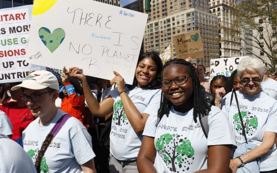 Students from St. Joseph High School in Brooklyn, New York, smile as they participate in the Global Climate Strike in New York City Sept. 20, 2019. James Holzhauer-Chuckas, a youth minister in Evanston, Illinois, said many young Catholics are very concern