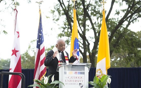 Washington Archbishop Wilton Gregory blesses the "Angels Unawares" sculpture at The Catholic University of America in Washington Sept. 27. (CNS/Tyler Orsburn)