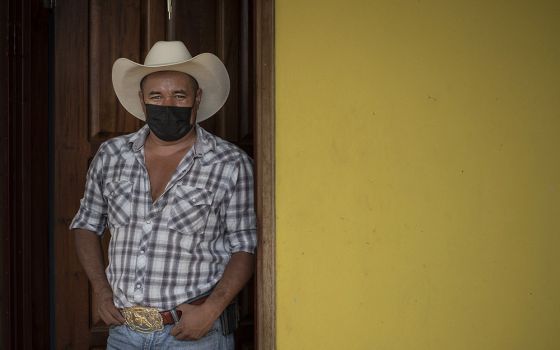 Freddy Murio at the doorway to his home in Yorito, Honduras. After 12 years as an undocumented immigrant in New York, Murio is now running for mayor of his hometown, hoping to address the ills driving an exodus from the country. (Manuel Ortiz Escámez)