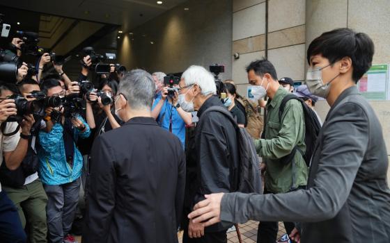 From right, Hong Kong singer Denise Ho, Hong Kong scholar Hui Po-keung, Catholic Cardinal Joseph Zen and barrister Margaret Ng and arrive for an appearance at a court in Hong Kong as they were charged in relation to their past fundraising for activists, T