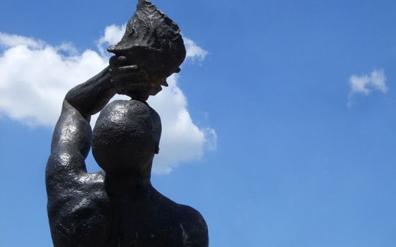 Detail of "Le marron inconnu," a bronze statue of a Black man escaped from slavery and blowing a conch shell trumpet. Created by Haitian architect and sculptor Albert Mangonès, the statue stands across from the National Palace in Port-au-Prince, Haiti.