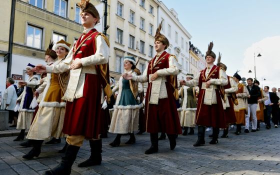 People in Warsaw, Poland, celebrate Sept. 29, ahead of the Nov. 11 centenary of Polish independence. (CNS/EPA/Marcin Obara)