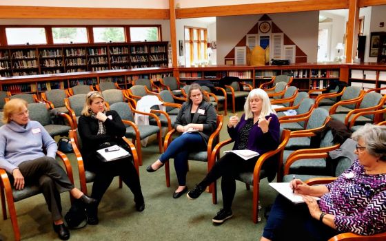 Members of Catholics for Change in Our Church take part in a small-group discussion during the January meeting of the group, which advocates for reform in the Pittsburgh Diocese. (Kevin Hayes)