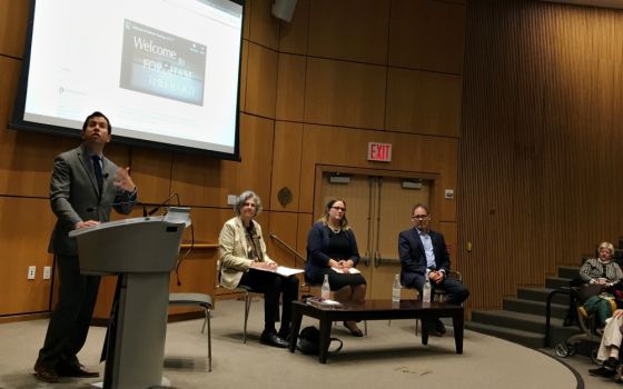 J. Patrick Hornbeck II, chair of the Theology Department at Fordham University, introduces (from left) Phyllis Zagano, Meghan Clark and George Demacopoulos, panelists for the symposium on women deacons Oct. 22 in New York. (NCR photo/Sarah Salvadore)