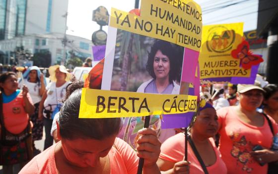 Women hold photo of slain Honduran environmental rights activist Berta Cáceres during protest in 2016. Honduras has not signed the Escazú Agreement, which took effect April 22 and protects people like Cáceres who stand up for human and environmental right