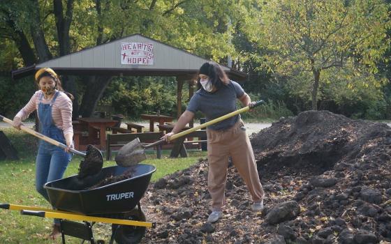 Two women work on a garden at Sacred Heart Parish Mission in the Diocese of Joliet, Illinois. The food grown will be distributed to people in need of food assistance. (CNS photo/courtesy Diocese of Joliet)