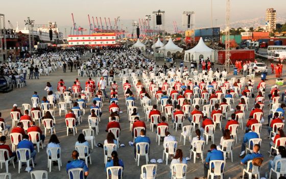 People attend a Mass celebrated by Cardinal Bechara Rai, Maronite patriarch, Aug. 4 to mark the one-year anniversary of Beirut's port blast. The explosion killed more than 200 people, injured more than 6,000, and displaced more than 300,000. (CNS photo/Mo