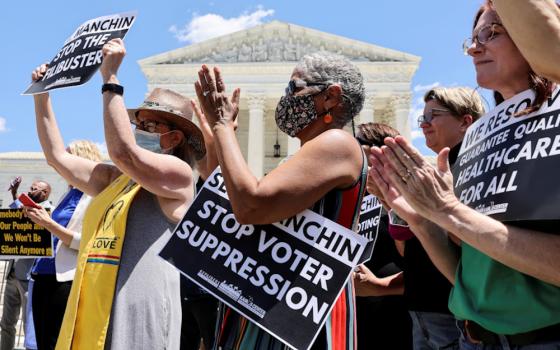 Demonstrators in Washington rally in support of voting rights legislation June 23. (CNS/Reuters/Evelyn Hockstein)