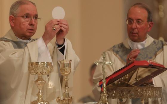 Archbishop José Gomez of Los Angeles, president of the U.S. Conference of Catholic Bishops, concelebrates Mass with Archbishop William Lori of Baltimore Nov. 15 in Baltimore. (CNS/Bob Roller)