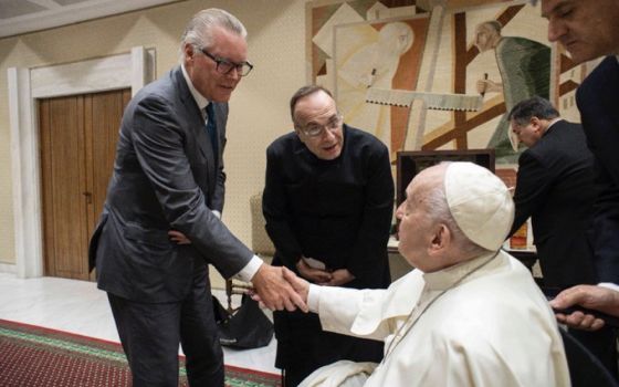 Delta Airlines CEO Ed Bastian and Fr. Jim Sichko of the Diocese of Lexington, Kentucky, meet with Pope Francis on May 18 at the Vatican. (Photo courtesy of Fr. Jim Sichko)