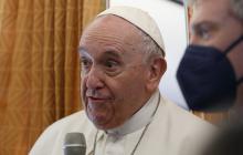 Pope Francis greets journalists aboard his flight from Rome to Malta April 2, 2022.