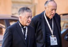 Chicago Cardinal Blase Cupich, left, and San Diego Cardinal Robert W. McElroy arrive for a session of the first assembly of the synod on synodality in the Vatican's Paul VI Audience Hall Oct. 17, 2023. (CNS/Lola Gomez)