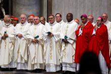 Cardinals pray during Mass presided by Cardinal Mario Grech, secretary-general of the Synod, at the Altar of the Chair in St. Peter’s Basilica at the Vatican Oct. 21, 2024. (CNS/Lola Gomez)