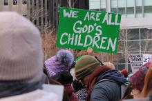 A participant holds a sign during a Jan. 25, 2025, interfaith rally in support of immigrants at Love Park in downtown Philadelphia. The event, organized by nonprofit New Sanctuary Movement, challenged city officials to push back on Trump administration policies that restrict immigration and include plans for mass deportations of unauthorized immigrants. (OSV News/Gina Christian)