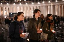 People join in reciting the rosary for Pope Francis in St. Peter's Square at the Vatican Feb. 24, 2025. 