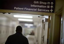 A sign points visitors toward the financial services department at a hospital in this file photo. The Catholic Health Association has issued a plea to congressional leadership asking them to reject funding cuts and structural changes to Medicaid. (AP photo/David Goldman, File)