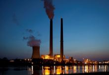 A file photo shows smoke from the American Electric Power's coal-fired Mountaineer Power Plant along the banks of the Ohio River in New Haven, W.Va. (OSV News/Jim West)