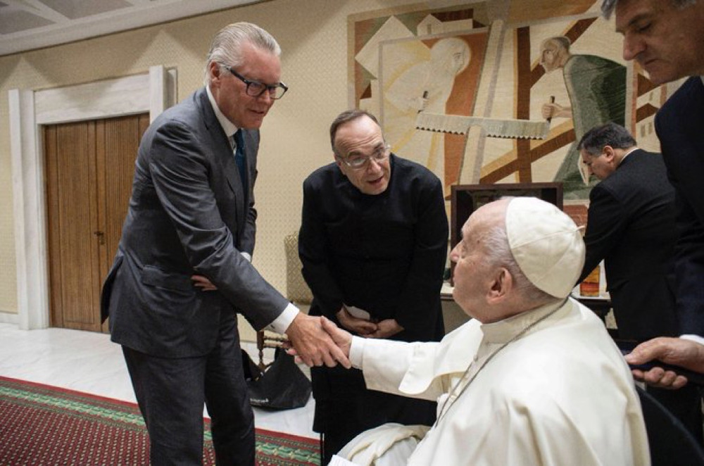 Delta Airlines CEO Ed Bastian and Fr. Jim Sichko of the Diocese of Lexington, Kentucky, meet with Pope Francis on May 18 at the Vatican. (Photo courtesy of Fr. Jim Sichko)